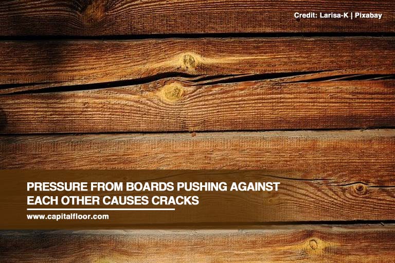 Pressure from boards pushing against each other causes cracks